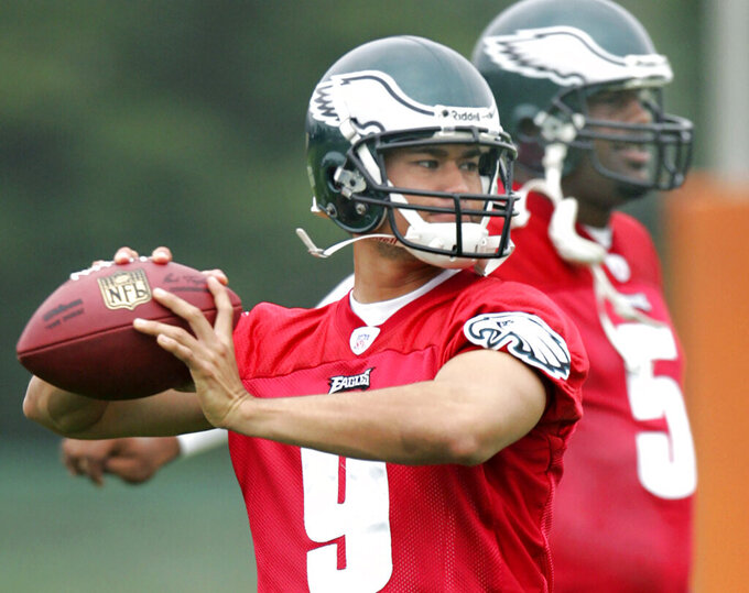 FILE - Philadelphia Eagles quarterback Timmy Chang prepares to pass the ball during an NFL football camp July 22, 2006, in Bethlehem, Pa. The University of Hawaii has hired former quarterback Chang as its new head coach. Athletics director David Matlin announced Chang’s hiring on Saturday, Jan. 22, 2022, in a news release. (AP Photo/Rusty Kennedy, File)