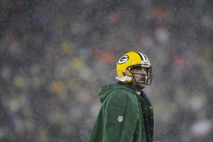 Green Bay Packers' Aaron Rodgers looks up during the second half of an NFC divisional playoff NFL football game against the San Francisco 49ers Saturday, Jan. 22, 2022, in Green Bay, Wis. (AP Photo/Aaron Gash)