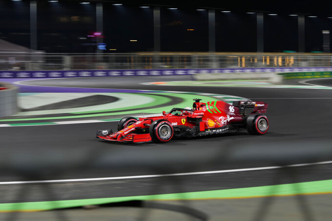 Ferrari driver Charles Leclerc of Monaco in action during practice session for the Saudi Arabian Grand Prix in Jiddah, Friday, Dec. 3, 2021. (AP Photo/Hassan Ammar)