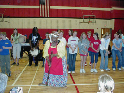 Anita Singleton-Prather, in the buttery dialect of the South, sings and gets students involved at St. Henry schools on Wednesday. The South Carolina barrier island native recently shared Gullah history through humor and music.<br>dailystandard.com