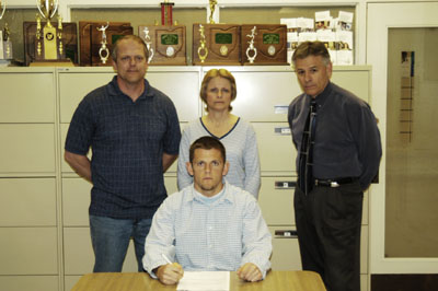 Coldwater senior Kevin Brackman will attend Capital University in Columbus next fall and play football for a Crusader program that went 8-2 last season and 7-2 in the Ohio Athletic Conference. Kevin is joined by parents Ken and Cathy Brackman. Coldwater head football coach John Reed is also shown in the picture.<br>dailystandard.com