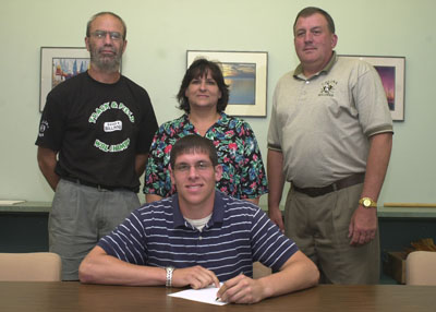 Celina catcher Sean Boley, seated, will join his older brother and twin brother on the University of Toledo baseball team next season. Joining Sean in the signing of his letter of intent is Celina Dean of Athletics Dan Otten, mother Linda Boley and father and baseball coach Bruce Boley.<br>dailystandard.com