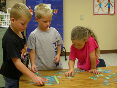Students at Two By Two Child Development Center in Coldwater work together on a puzzle at the facility. The center is one of two area preschool/childcare facilities in Mercer County housing the new Head Start Plus program. The other facility is the YMCA along state Route 703 in rural Celina.<br>dailystandard.com