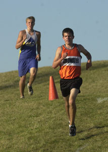 Coldwater's David Wilker leads Marion Local's Ryan Winner during Tuesday's meet at Minster's Four Seasons Park.<br>dailystandard.com