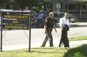 Dr. Thomas Santanella is led to the Mercer County Jail Thursday afternoon following his sentencing to five years probation and 90 days in jail on 88 counts related to his former practice in Celina.<br>dailystandard.com