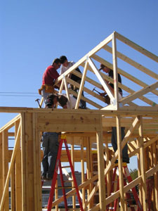 Celina graduates have stepped in to help with the Tri Star house after their construction teacher Dave Borger underwent heart surgery following a heart attack several weeks ago. Above, Tri Star seniors attend to the framing of the 2005 house under the supervision of Joe Rose and Mark Steinlage of Rose Construction, Celina firefighter Jeff Garman and substitute teacher Bill Simons. <br>dailystandard.com