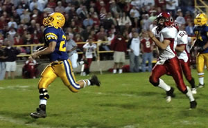 St. Marys' Justin Nagel, left, runs in the open field away from the Kenton defense on his way for a 57-yard touchdown to seal the game for the Roughriders in the fourth quarter. Nagel ran the ball just 14 times but totaled 132 yards and three touchdowns to lead the Roughriders to a 33-15 win over the Wildcats. The win, coupled with a Shawnee loss, puts St. Marys back into a first-place tie in the Western Buckeye League with Shawnee.<br>dailystandard.com