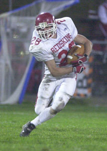St. Henry's Jon Hemmelgarn runs in the open field during the Redskins' game against Versailles on Friday night. Hemmelgarn ran for 119 yards and caught the game-winning touchdown with 28.4 seconds to go in the game for a 24-17 victory.<br>dailystandard.com