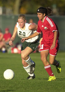 Celina's Lindsay Schmitmeyer, 20, tries to outrun Bowling Green's Dana Chalupa during Tuesday's match in Findlay.<br>dailystandard.com