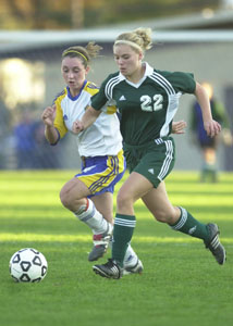 Celina's Robin Snyder, 22, dribbles the ball up the field during their district semifinal match against Findlay on Wednesday.<br>dailystandard.com