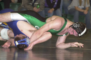 Celina's Jantzen Hinton, top, tries to pull St. Marys' Aaron Dietz over for backpoints and a possible pinfall during Tuesday's WBL match. Hinton got the pin in 3:48 to help Celina win 51-28.<br>dailystandard.com
