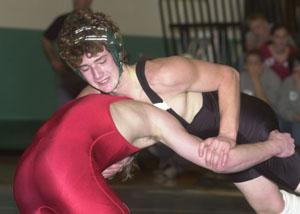 Celina's Kiel Hawk looks to try and gain some leverage on Kenton's Kevin Modd during Thursday's dual match. Hawk beat Modd 12-2 to help Celina post a shutout over the Wildcats 81-0.<br>dailystandard.com