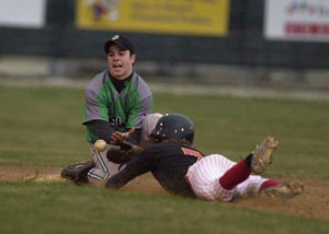 Celina shortstop Nick Gray, left, tries to dig the ball out of the dirt as New Bremen's Andy McMurray, right, steals second base during their matchup on Friday night. The Bulldogs are now off to a 4-0 start after picking up a 10-9 victory over the Cardinals.<br>dailystandard.com