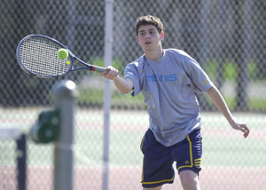 St. Marys' Jameel Brenneman, pictured, hits a forehand back to Celina's Neil Hoyng during their third singles match on Tuesday afternoon. Brenneman defeated Hoyng, 4-6, 7-6 (7-3), 7-5, in a match that lasted over two hours in helping St. Marys defeat Celina, 4-1.<br>dailystandard.com