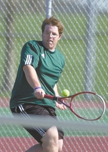Celina's Brent Householder hits a backhand back to his opponent during the second singles match against Lima Central Catholic on Thursday in Coldwater.<br>dailystandard.com