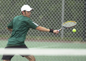 Celina's Brad Krick returns a shot from Defiance's Diego Lopez. Krick rallied from being a point away from losing the second set to beat Lopez in three sets on Friday.<br>dailystandard.com