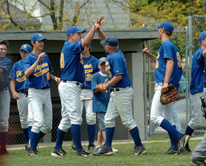 Marion Local players celebrate after capturing a sectional baseball title on Saturday with a 6-5 victory over Minster at Hanover Street Park. Marion Local scored two runs in the seventh inning to pull out the win.<br>dailystandard.com