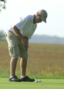 Celina's Ryan Moran putts on the green during his round against Elida at the Fox's Den on Monday afternoon. Moran led Celina with a round of 37 to help the Green and White to a 157-179 win over Elida.<br></br>dailystandard.com