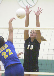 Celina's Liz Homan, 13, makes a block on Lehman's Jessica Sargent, 22, during their match on Tuesday night. Celina lost to the top-ranked team in Division IV in three games.<br></br>dailystandard.com