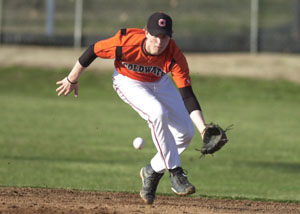 Coldwater shortstop Cory Klenke charges a ground ball during the Cavaliers' game against Mississinawa Valley on Friday night. Coldwater won the game, 12-1 in a five-inning affair.<br></br>dailystandard.com