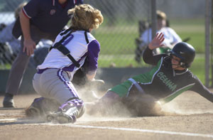 Celina's Melanie Heyne, right, slides safely into home past Fort Recovery catcher Renee Evers, left, during their Mercer County matchup on Monday afternoon. Celina defeated Fort Recovery 11-1 in five innings to improve to 6-0 on the season.<br></br>dailystandard.com