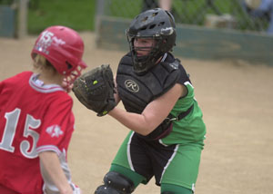 Celina catcher Megan Sutter, right, waits with the ball at home plate to tag out a Van Wert baserunner during their Western Buckeye League matchup on Thursday at Bill Feth Diamond. Sutter had two hits to help lead Celina past Van Wert, 9-1.<br></br>dailystandard.com