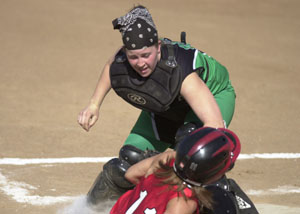 Celina catcher Megan Sutter, top, tags out Shawnee's Brooke Schultz, bottom at the plate in the first inning for an out during their Western Buckeye League matchup on Tuesday at Bill Feth Diamond. Celina went on to beat Shawnee, 8-2, to stay undefeated on the season at 9-0.<br></br>dailystandard.com