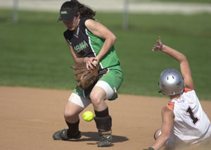 Celina's Allison Braun, left, can't catch the ball at second base as Coldwater's Renee Hemmelgarn, 1, slides in safely with one of her four stolen bases. Celina went on to defeat Coldwater, 12-6.<br></br>dailystandard.com