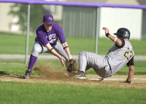 Parkway's Jensen Painter, right, slides safely into third base during the first inning of their ACME contest on Monday as Fort Recovery's Craig Garman, left, puts on the late tag. <br></br>dailystandard.com