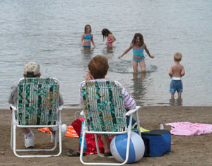 Sun bathers and swimmers of all ages enjoy an afternoon at Huffy's pond east of Celina on Tuesday.<br></br>dailystandard.com