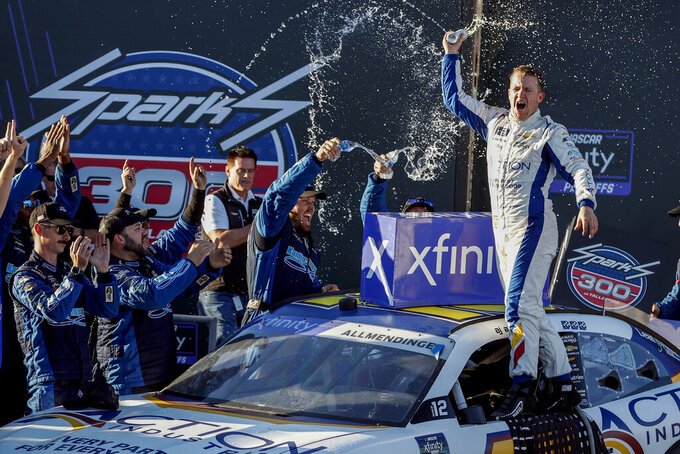 Driver AJ Allmendinger celebrates in Victory Lane after winning the NASCAR Sparks 300 auto race Saturday, Oct. 1, 2022, in Talladega, Ala. (AP Photo/Butch Dill)