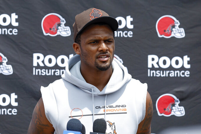 Cleveland Browns quarterback Deshaun Watson answers a question at the NFL football team's practice facility Tuesday, June 14, 2022, in Berea, Ohio. (AP Photo/Ron Schwane)