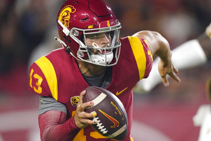 Southern California quarterback Caleb Williams rolls out during the first half of an NCAA college football game against Arizona State Saturday, Oct. 1, 2022, in Los Angeles. (AP Photo/Mark J. Terrill)