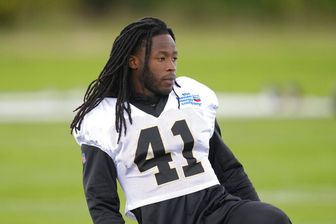 New Orleans Saints running back Alvin Kamara looks on during an NFL practice session at the London Irish rugby team training ground in Sunbury-on-Thames near London, Wednesday, Sept. 28, 2022 ahead of the NFL game against Minnesota Vikings at the Tottenham Hotspur stadium on Sunday. (AP Photo/Kirsty Wigglesworth)